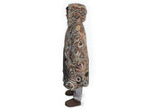 Neutral-toned oversized wearable blanket hoodie with Aboriginal-inspired pattern and front kangaroo pocket