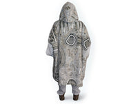 Oversized brown wearable hooded blanket featuring Indigenous-inspired dot art pattern and fleece interior