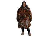 Oversized brown wearable hooded blanket featuring Indigenous aboriginal  inspired dot art pattern and fleece interior