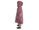 Woman wearing pink oversized hooded blanket with Indigenous aboriginal inspired artwork and plush fleece lining