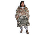 Neutral-toned oversized wearable blanket hoodie with Aboriginal-inspired pattern and front kangaroo pocket