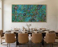 Dining room with a large Modern Aboriginal painting print for interior designers and collectors painting on the wall, set table, and chairs.