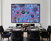 Large colourful Aboriginal artwork by T'keyah Ware creating a statement feature wall in a luxury black dining room.