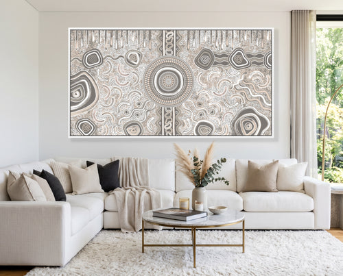 Large Camping Under the Moonlight Aboriginal canvas print displayed above a modern white sofa.