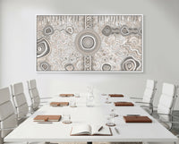 Camping Under the Moonlight Aboriginal art canvas print displayed in a modern boardroom meeting space.