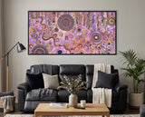 Family Day Out Aboriginal artwork displayed above a black leather lounge in a contemporary home interior.