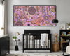 Family Day Out Aboriginal artwork displayed in a contemporary nursery with black cot and natural decor.