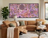 Family Day Out original Aboriginal painting by Kelly Taylor displayed in a warm earthy living room.