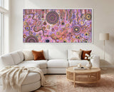 Family Day Out original Aboriginal painting by Kelly Taylor displayed in a white contemporary lounge room.