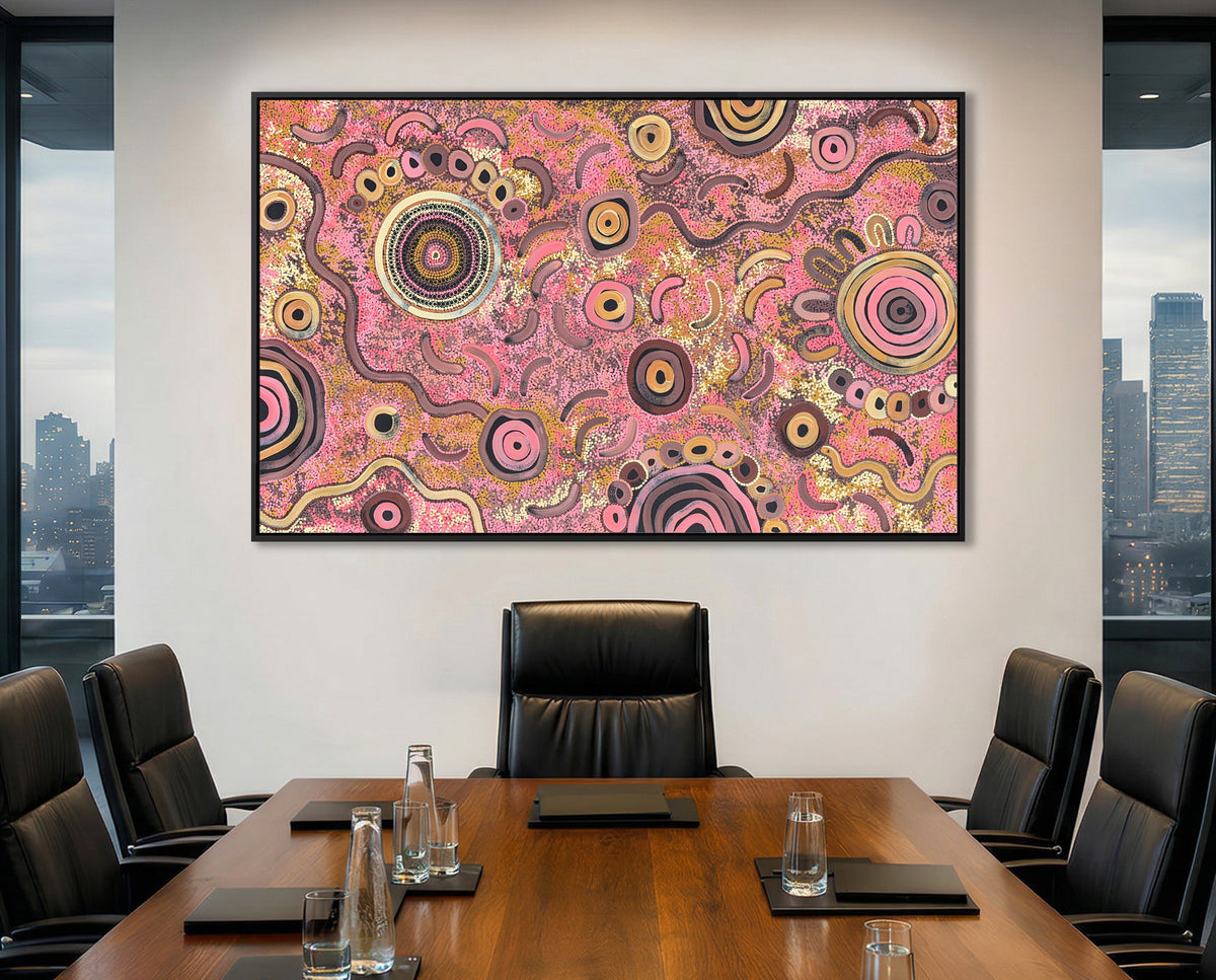 Boardroom with a large abstract aboriginal art painting on the wall, cityscape visible through windows.