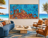 Desert Meets the Sea original Aboriginal painting by Kelly Taylor displayed in a contemporary coastal living room overlooking the beach.