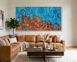 Desert Meets the Sea Aboriginal wall art by Kelly Taylor displayed above a contemporary lounge setting.