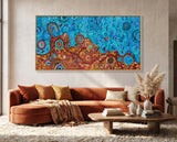 Desert Meets the Sea Aboriginal wall art by Kelly Taylor displayed above a contemporary lounge setting.