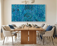 Dining room with a wooden table and chairs, and a large blue rain aboriginal art abstract painting on the wall.
