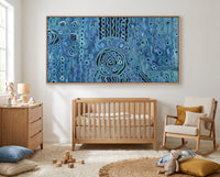 Nursery room with wooden crib, rocking chair, and abstract blue rain aboriginal art artwork on the wall.