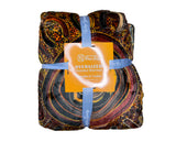 Oversized brown wearable hooded blanket featuring Indigenous-inspired dot art pattern and fleece interior