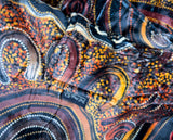 Oversized brown wearable hooded blanket featuring Indigenous aboriginal  inspired dot art pattern and fleece interior