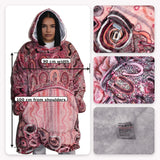 Indigenous aboriginal Hooded blanket with pink and purple pattern, shown on a person and with close-up details.