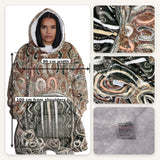 Hooded patterned garment with measurements and fabric texture details.